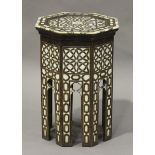 A 20th century Middle Eastern hardwood octagonal table, inlaid in mother-of-pearl and bone, height