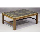 A late 20th century campaign style coffee table, the glazed top reverse printed with portraits of