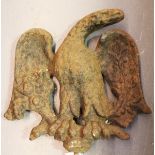 A 19th century cast iron mount in the form of a stylized eagle, height 35cm, width 37cm.Buyer’s