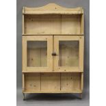 A late Victorian pine kitchen wall cabinet, fitted with two glazed doors, height 100cm, width