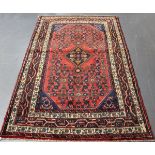 A Malayer rug, North-west Persia, mid/late 20th century, the claret field with a lozenge