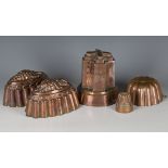 A group of five copper jelly moulds, including a pair by Benham & Froud, numbered '1A' and '70A',