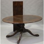 A late 20th century reproduction oak oval extending dining table, the top with single extra leaf,
