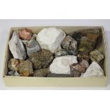 A selection of mineral specimens, including a small section of amethyst rock crystal, jasper and