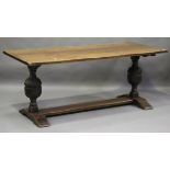 A mid-20th century Jacobean Revival oak refectory table, on carved cup and cover supports, height