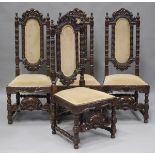 A set of four 20th century Baroque Revival carved walnut dining chairs, the front legs united by