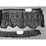 A quantity of late 19th and 20th century Chantilly black lace, including veiling, borders, edging,