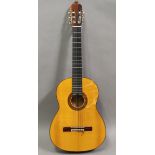 A classical six-string acoustic flamenco guitar by Antonio Ariza, bearing label and signed to