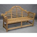 A modern hardwood garden bench, after a design by Edwin Lutyens, height 106cm, width 165cm, depth