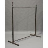A 20th century Gothic style iron clothes rail with pointed spear finials, height 173cm, length