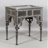 A late 19th century Middle Eastern ebonized bijouterie table, inset with overall panels of finely