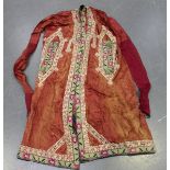 An early/mid-20th century Middle Eastern magenta silk wedding gown, Uzbekistan, the edges