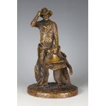 Michael Garman - a late 20th century gilt and brown patinated cast bronze figure of a cowboy, the