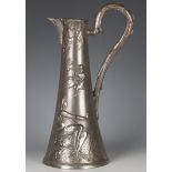 An Art Nouveau plated pewter jug, the flared body cast with a seated maiden and cherub to both