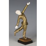An Art Deco Continental gilt cast bronze and carved ivory figure of a dancing Dutch girl, raised