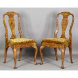 A pair of 18th century floral marquetry elm and walnut vase back dining chairs, each back inlaid