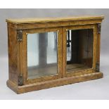 A mid-Victorian burr walnut pier cabinet, the associated top with simulated surface above a gilt