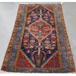 A Hamadan rug, North-west Persia, early 20th century, the navy blue field with a stepped pole