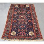 A Hamadan rug, North-west Persia, early 20th century, the dark blue field with overall medallions