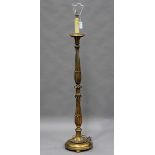 An early 20th century Italianate carved giltwood lamp standard, height 147cm.Buyer’s Premium 29.