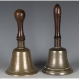 A 19th century bronze handbell with turned walnut handle, length 24cm, together with another similar