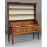 A George III provincial pine kitchen dresser, the shelf back above three drawers, height 182cm,