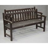 A pair of late 20th century stained wooden slatted garden benches, height 84cm, width 152cm, depth