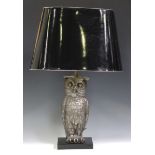 A modern plated cast metal table lamp in the form of an owl, fitted with a tole painted shade,