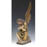 An early 20th century gilded and painted plaster figure of a kneeling angel, height 69cm (faults,