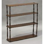 A Victorian mahogany four-tier wall shelf with turned spindle supports, height 71cm, width 65.5cm,
