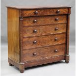 A mid-Victorian flame mahogany chest of five drawers, all with applied turned handles flanked by