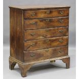 An early George III provincial fruitwood chest of five long oak-lined drawers, raised on bracket