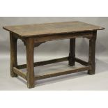 A 17th century and later oak refectory table, the cleated three-plank top on chamfered block legs