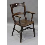 A Victorian ash Windsor armchair, the bar and comb back above a solid seat, on turned legs, height