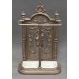 A late Victorian cast iron stick stand, the pierced foliate back with central fruit spray, height