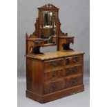 A late Victorian walnut dressing chest, fitted with a central swing mirror and drawers, height