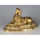A 19th century Continental cast ormolu anthropomorphic model of a recumbent beast with female