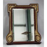 An early 20th century George II style mahogany and carved giltwood wall mirror with a bevelled plate