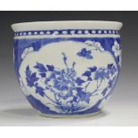 A Chinese blue and white porcelain jardinière, late 19th century, painted with opposing peony panels