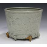 A Chinese celadon glazed censer, probably Ming dynasty, of cylindrical tapering form, carved in