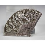 A Chinese silver brooch, early 20th century, in the form of a fan with lotus decoration, maker's