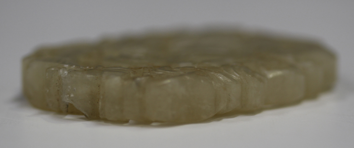 A Chinese pale celadon jade pendant, probably late Qing dynasty, carved and pierced to each side - Image 8 of 10