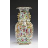 A Chinese Canton famille rose porcelain vase, mid-19th century, the shouldered ovoid body and flared