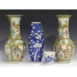 A pair of Chinese Canton famille rose porcelain vases, mid to late 19th century, each typically