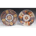 Two Japanese Imari porcelain circular dishes, Meiji period, one with panels of moths and butterflies