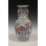 A Chinese Canton famille rose porcelain vase, mid to late 19th century, the ovoid body painted