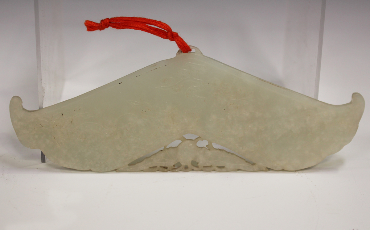 A Chinese pale celadon jade chime pendant (huang), late Qing dynasty/early 20th century, each side