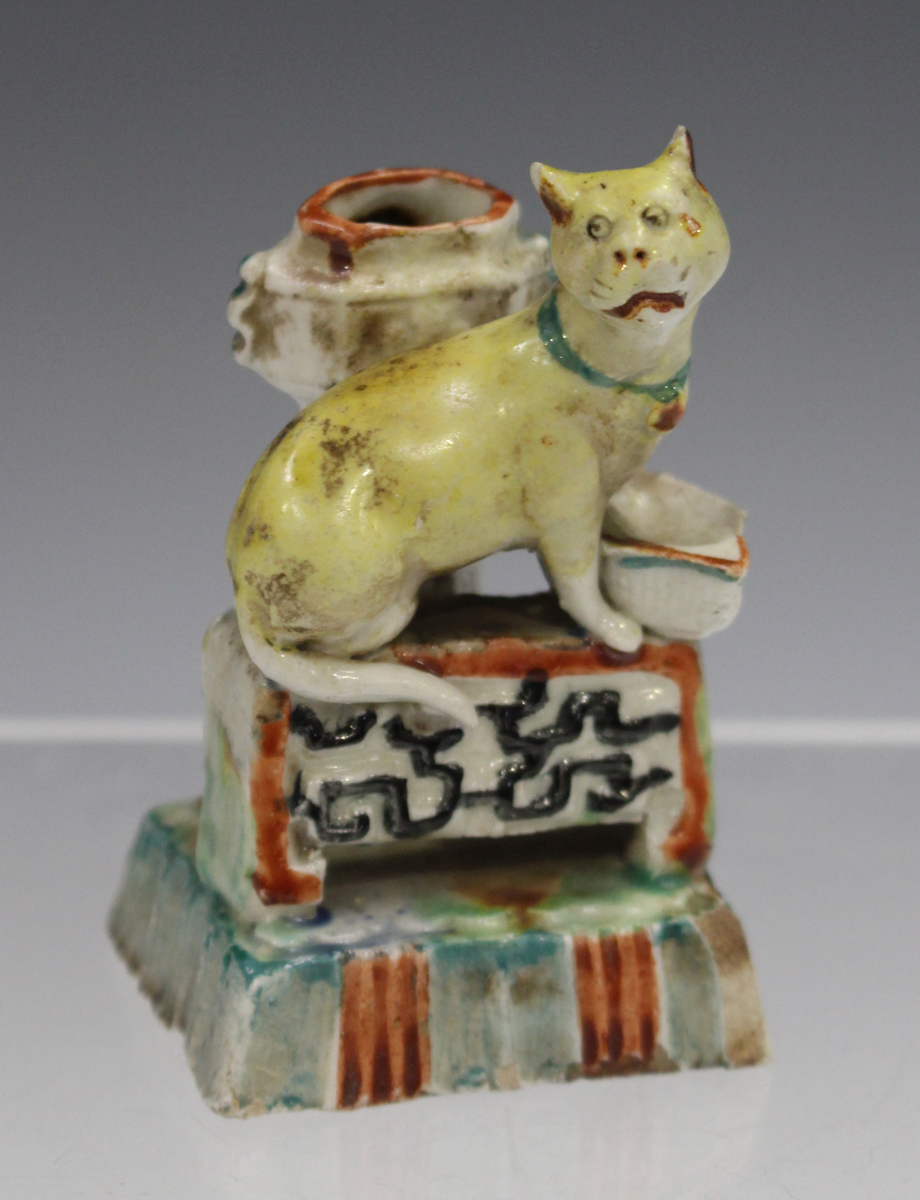 A rare Chinese enamelled blanc-de-Chine porcelain miniature cat jostick holder, Kangxi period,