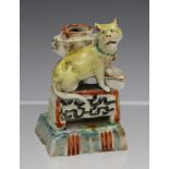 A rare Chinese enamelled blanc-de-Chine porcelain miniature cat jostick holder, Kangxi period,