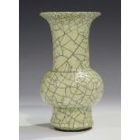 A Chinese Guan-type crackle glazed stoneware vase, the globular body and flared neck covered in a